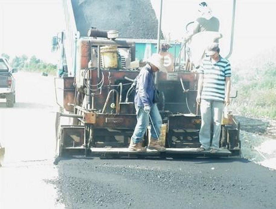 Asphalt paver laying a new surface